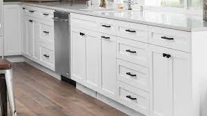 Have you recently visited a friend who had an attractive kitchen with white cabinets and black hardware? White Shaker Cabinets Lakehouse Remodel Highcraft Cabinets