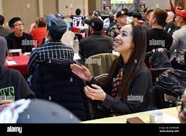 Erika Katagiri, an employee at the Camp Zama Commissary, cheers for the San  Francisco 49ers during