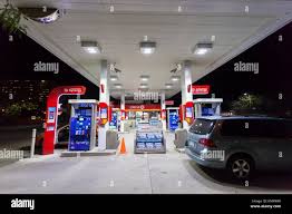 illuminated petrol pumps hi res stock
