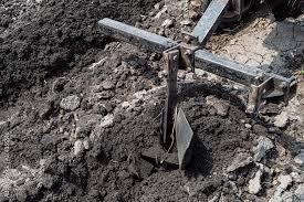 plow makes furrow in soil close up